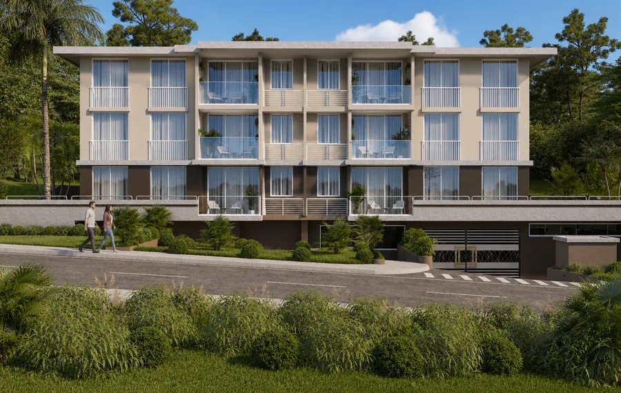 Clayton Lux visto desde la calle, con jardines al frente